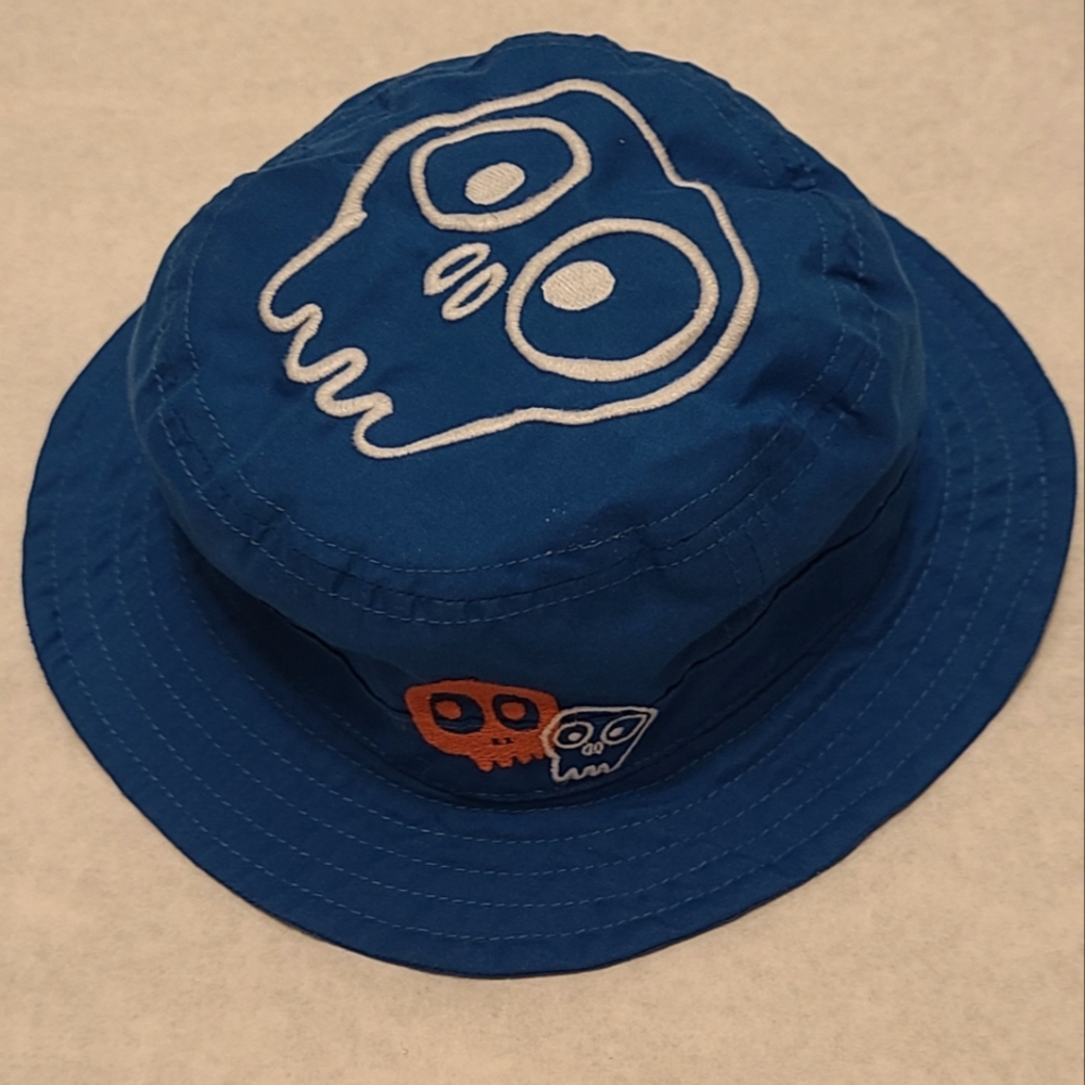 Blue bucket style hat with skull graphic